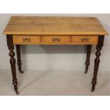 AN EARLY 20TH CENTURY CAPE YELLOWWOOD AND STINKWOOD WRITING TABLE, the moulded top above three short