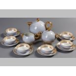 A LIMOGE "BRUXELLES" PATTERN TEA SET, comprising a teapot, creamer, sugar bowl, nine cups and twelve