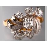 AN 18CT YELLOW GOLD, WHITE GOLD AND DIAMOND RING, centre brilliant cut claw set diamond of