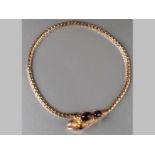 A 9CT YELLOW GOLD CABOCHON GARNET BRACELET, one end in the form of a serpent's head, eyes set in