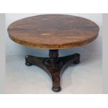 AN EARLY VICTORIAN ROSEWOOD CIRCULAR DINING TABLE, the well figured top with a beaded frieze