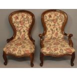 A PAIR OF VICTORIAN MAHOGANY GRANDFATHER AND GRANDMOTHER CHAIRS, the hooped backs with carved top-