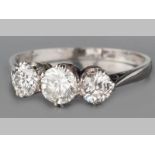 A PLATINUM AND DIAMOND RING, comprising of three brilliant cut claw set diamonds of approximately