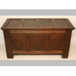 AN 18TH CENTURY CONTINENTAL OAK COFFER, the top with four moulded panels, the front with three