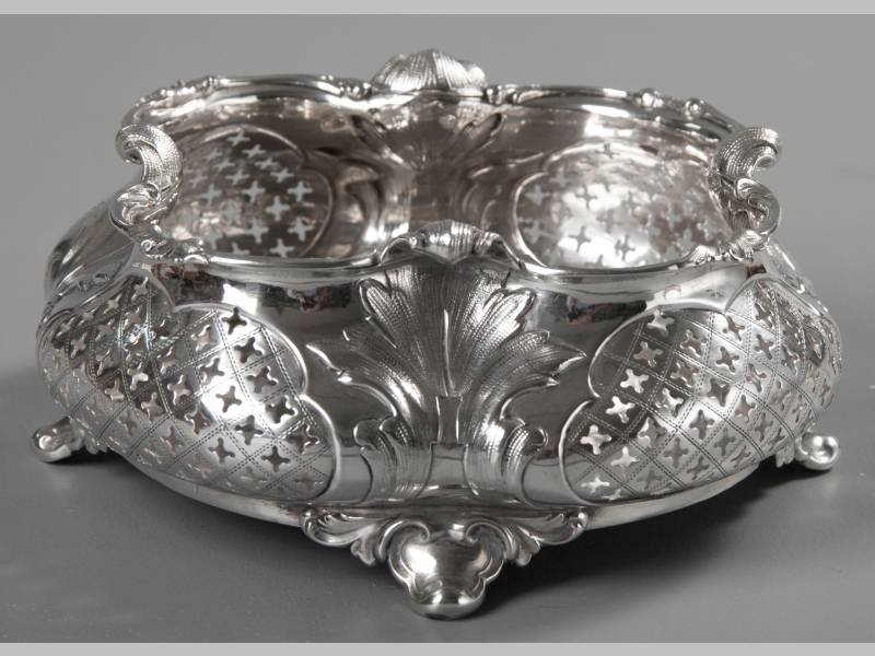 A POLISH SILVER BOWL, BY STRUBE & SOHN, with a fold-over embossed border, the segmented body with