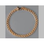 A 9CT YELLOW GOLD AND DIAMOND TENNIS BRACELET, comprising of forty-three diamonds of approximately