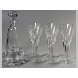 A SET OF SIX CRYSTAL GLASSES, flute form engraved with square forms, together with a matching