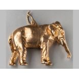 A 9CT YELLOW GOLD ELEPHANT CHARM, 3cm long, 11.4g.