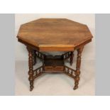 AN EDWARDIAN BEECH OCTAGONAL SMALL SERVING TABLE, the top veneered, the reeded frieze above four