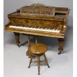 AN EARLY 20TH CENTURY GRAND PIANO IN BURR WALNUT BY AUGUST FÖRSTER, LÖBAU, SAXONY, with twin pedals,