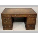 A 19TH CENTURY MAHOGANY PARTNERS DESK, the moulded top inlaid with a leather writing surface with