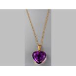 A 9CT YELLOW GOLD AND AMETHYST PENDANT, heart-shaped amethyst claw set in yellow gold frame with