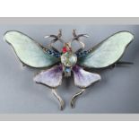 A WHITE METAL, PASTE AND ENAMEL BUTTERFLY BROOCH, the wings in green and purple enamel, decorated in