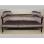 AN EDWARDIAN MAHOGANY AND UPHOLSTERED SETTEE, the blue draylon backrest and seat flanked by reeded