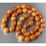 A STRING OF BUTTERSCOTCH AMBER BEADS, 43cm long, 22.2g.