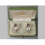 A 19TH CENTURY CONTINENTAL SET OF MOTHER-OF-PEARL AND RUBY CUFFLINKS AND COLLAR STUDS, of circular