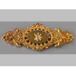 A VICTORIAN 15CT YELLOW GOLD AND DIAMOND BROOCH, centre rose-cut diamond set in starburst setting,