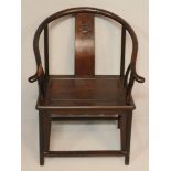 A CHINESE HARDWOOD ARMCHAIR, the horseshoe rail above a carved splat and spindles, drop-in seat,