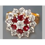 A 9CT YELLOW GOLD, DIAMOND AND GARNET RING, garnets and diamonds claw set in floral form, 4.4g.