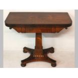 A WILLIAM IV MAHOGANY CARD TABLE, the well figured top rotating to reveal a well, standing on a