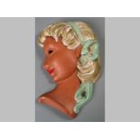 AN AUSTRIAN TERRACOTTA WALL MASK, by A.G. Mundner Keramik, lady with blonde hair and blue ribbon,