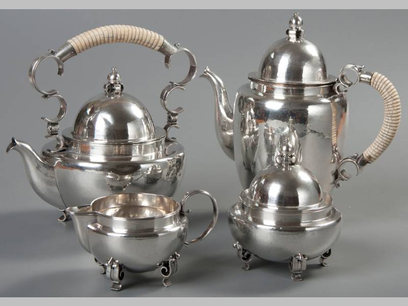 AN .835 STD CONTINENTAL SILVER FOUR PIECE TEA AND COFFEE SERVICE, comprising a tea kettle, coffee