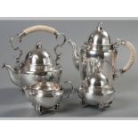 AN .835 STD CONTINENTAL SILVER FOUR PIECE TEA AND COFFEE SERVICE, comprising a tea kettle, coffee