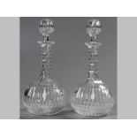 A PAIR OF VICTORIAN CUTGLASS DECANTERS, complete with ball stoppers, 30cm high, (2).