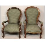 TWO VICTORIAN WALNUT ARMCHAIRS, each with a bowed top-rail above upholstered backs, armrests and