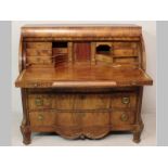 A 19TH CENTURY DUTCH MAHOGANY CYLINDER BUREAU, the rectangular top above a quarter-round cylinder