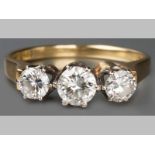 AN 18CT YELLOW GOLD AND DIAMOND RING, three brilliant cut claw set diamonds of approximately 0.