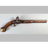 AN EARLY 19TH CENTURY LARGE BORE NAVAL FLINTLOCK TOWER PISTOL, mounted in a full length walnut