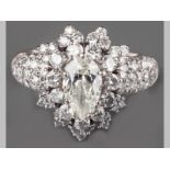 AN 18CT WHITE GOLD AND DIAMOND CLUSTER RING, centre pear shape diamond of 1.073ct, clarity SI2,