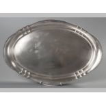 AN .800 STD SILVER TRAY, of oval form, with beaded rim, plain border and well, 51 by 34cm, 1006g.