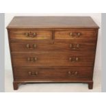 A GEORGE III MAHOGANY CHEST OF DRAWERS, the well figured top above two short and three long