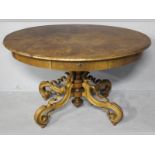 AN EARLY 20TH CENTURY CONTINENTAL WALNUT OVAL TABLE, the moulded top above a plain frieze housing