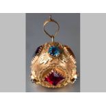 AN 18CT YELLOW GOLD AND MULTI-STONE BALL FORM CHARM, of large proportions, decorated with scrolls,