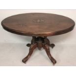 A VICTORIAN MAHOGANY OVAL TABLE, the inlaid top with a moulded edge standing on a central column and