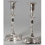 A PAIR OF EDWARDIAN SILVER CANDLESTICKS, SHEFFIELD 1908, D.E. & G.E., wax pans embossed with leaf