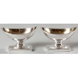 A PAIR OF GEORGE III SILVER OPEN SALTS, LONDON 1906, WILLIAM ABDY, boat shaped with fold-over rim,