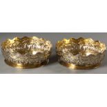 A PAIR OF VICTORIAN SILVER-GILT BOWLS, LONDON 1882, CHARLES STUART HARRIS, with wavy gadroon rims,