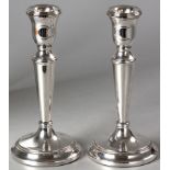 A PAIR OF SILVER CANDLESTICKS, BIRMINGHAM 1978, C.J.M., reeded rims, on circular base, 19cm high,