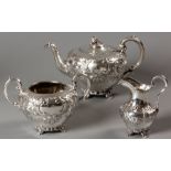 A VICTORIAN THREE PIECE SILVER TEA SET, SHEFFIELD 1850, R & H, comprising a teapot, creamer and