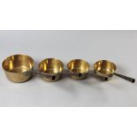 A SET OF FOUR 19th CENTURY CONTINENTAL SKILLETS, the turned brass bowls with heart-shaped iron