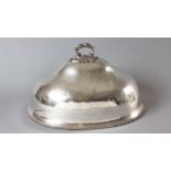 A SILVERPLATE MEAT DOME, removable floral embossed handle, plain body on gardrooned rim, interior