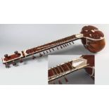 AN INDIAN SITAR, PROBABLY 19th CENTURY, the body of the instrument is framed in the form of a