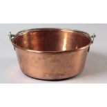 A CAPE COPPER JAM PAN, the vessel with everted rim, complete with iron swing-over handle, 37cm in