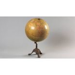 A PHILIPS TERRESTRIAL GLOBE, signed Fleet Street, London, mounted on a cast iron stand, possibly