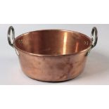 A LATE 19th CENTURY CAPE COPPER JAM PAN, the cylindrical vessel with an everted rim and cast iron