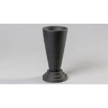 A BLACK WEDGWOOD JASPERWARE VASE, ovoid body on a stepped circular base, base impressed with factory